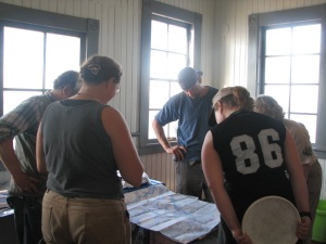 Docents explain a map of the area